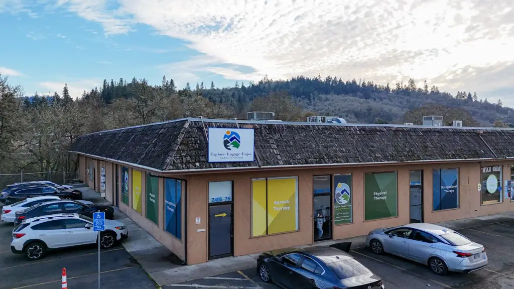 The Explore Engage Enjoy clinic building with its colorful window graphics